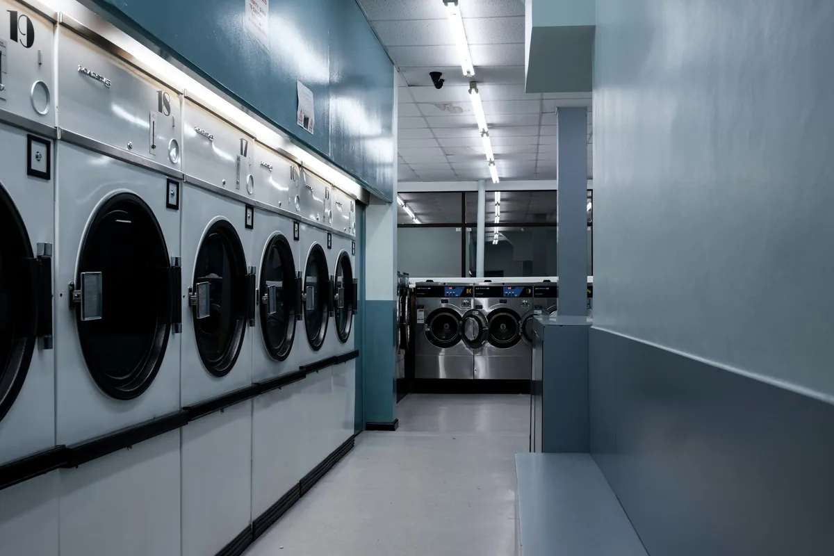 Illustrative stock photo of washing machines in an empty launderette.